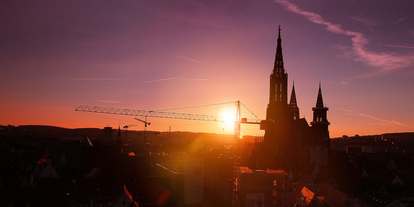 Sonne über der StadtS