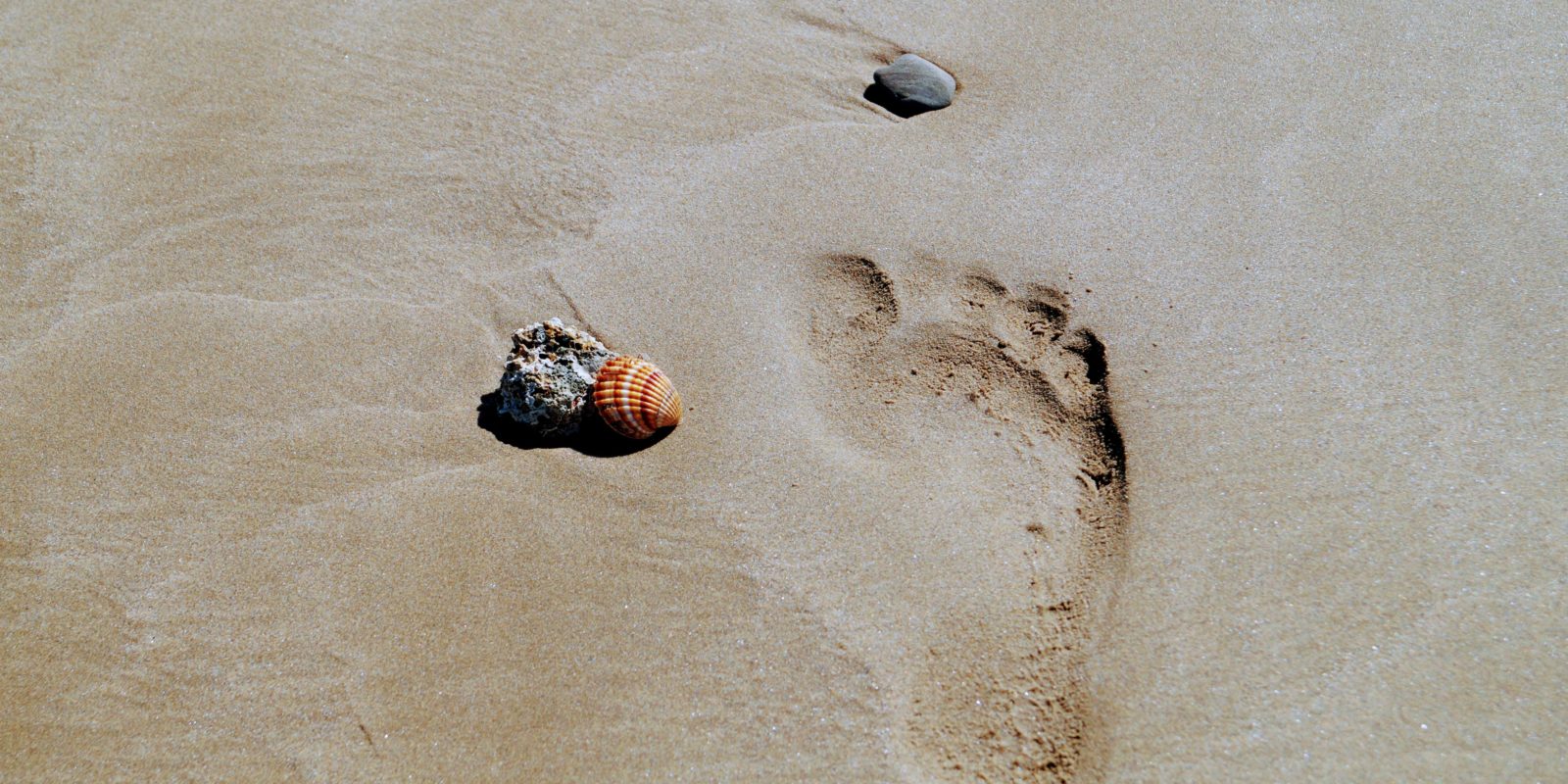 Fußabdruck im Sand