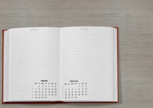 calendar, a book, date