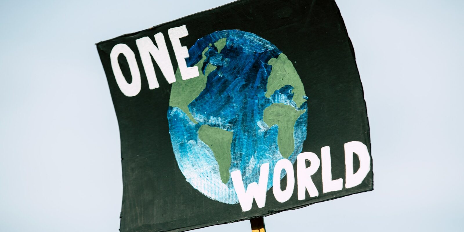 Schild one World